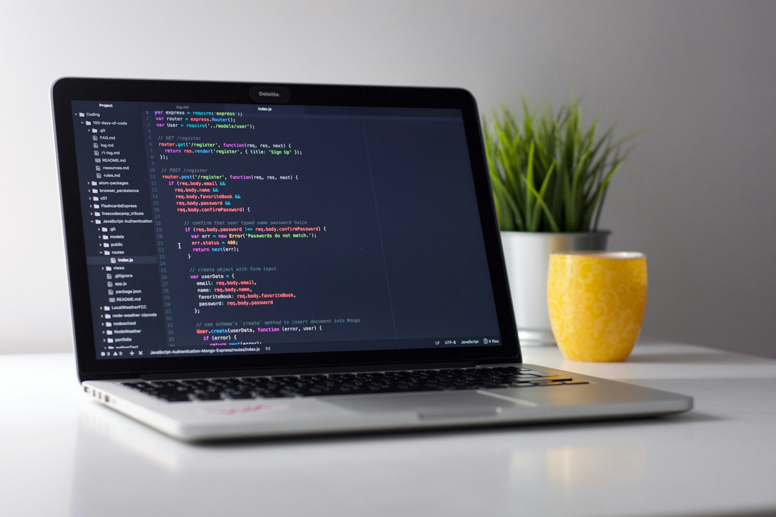 Laptop with code editor open
